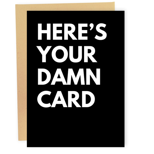 Black card with white text 'HERE'S YOUR DAMN CARD' on a white background