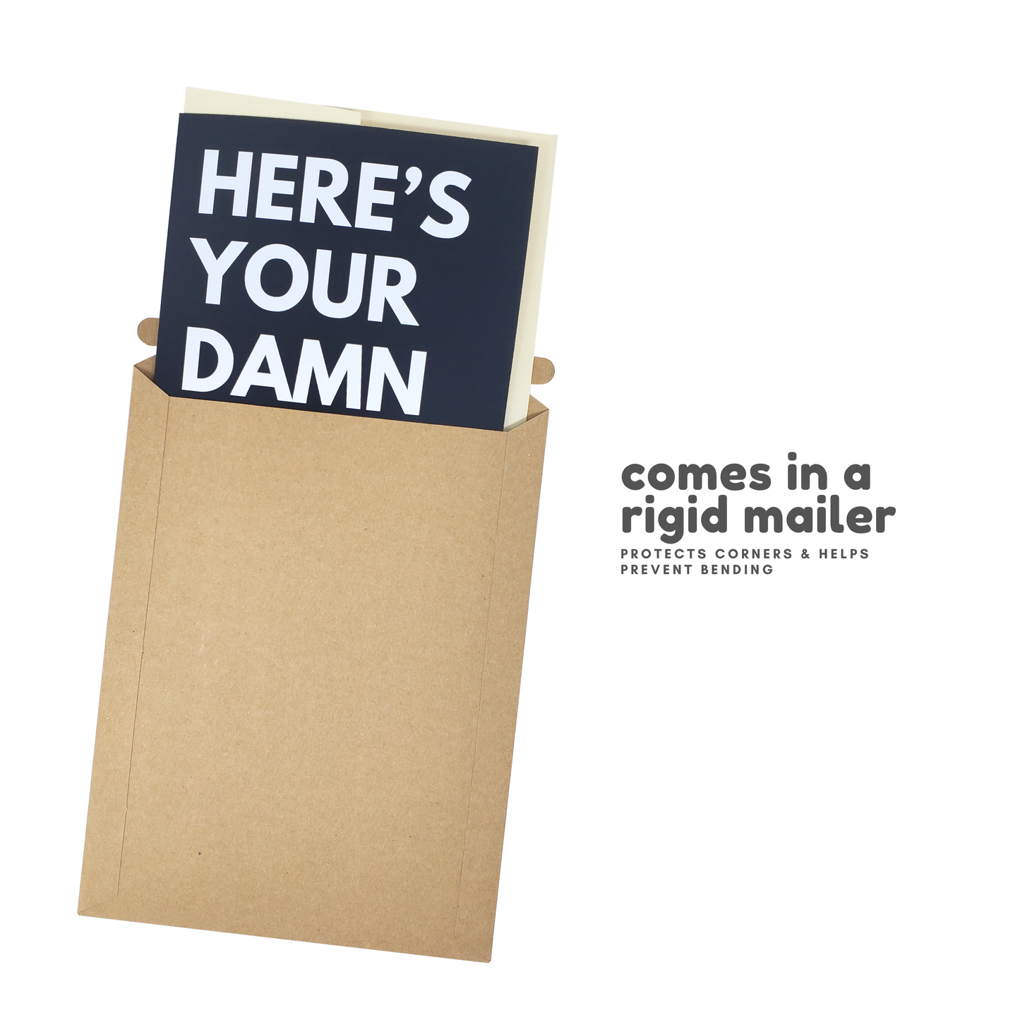 Card with 'HERE'S YOUR DAMN' text in a cardboard mailer on a white background