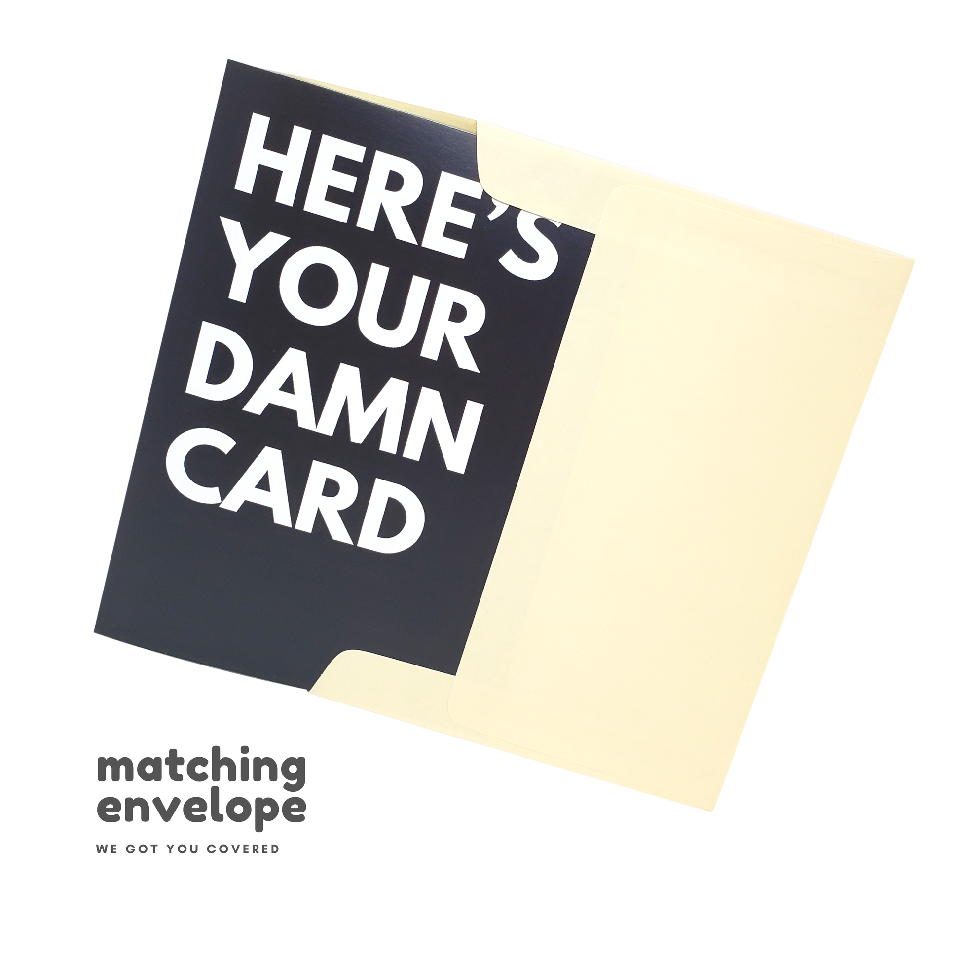 Greeting card with text 'HERE'S YOUR DAMN CARD' and matching envelope on a white background.