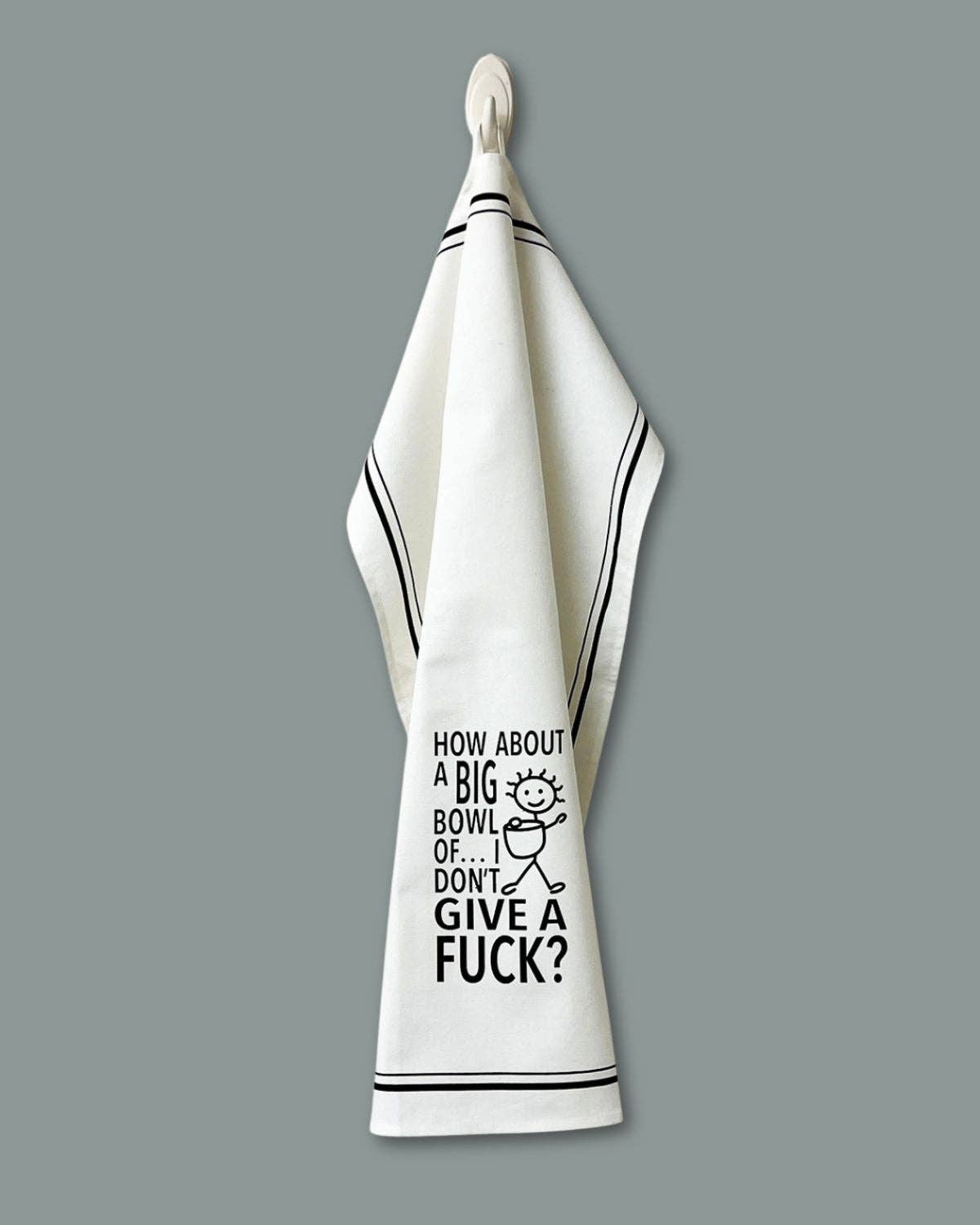 White towel with black text and graphic on a gray background