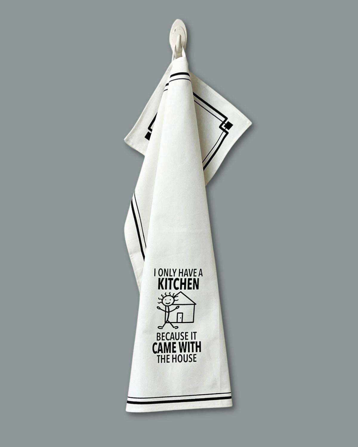 White towel with black text and design on a gray background