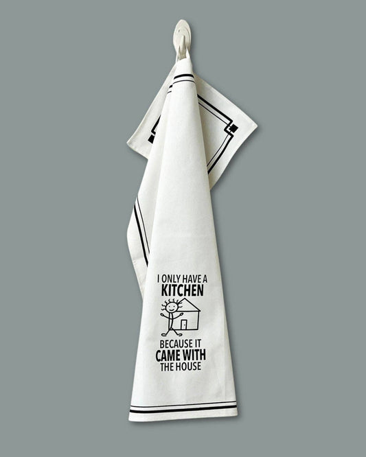 White towel with black text and design on a gray background