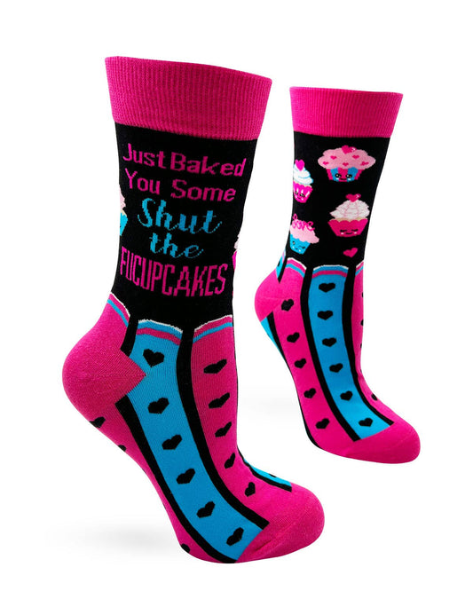 Colorful socks with text and cupcake designs on a white background
