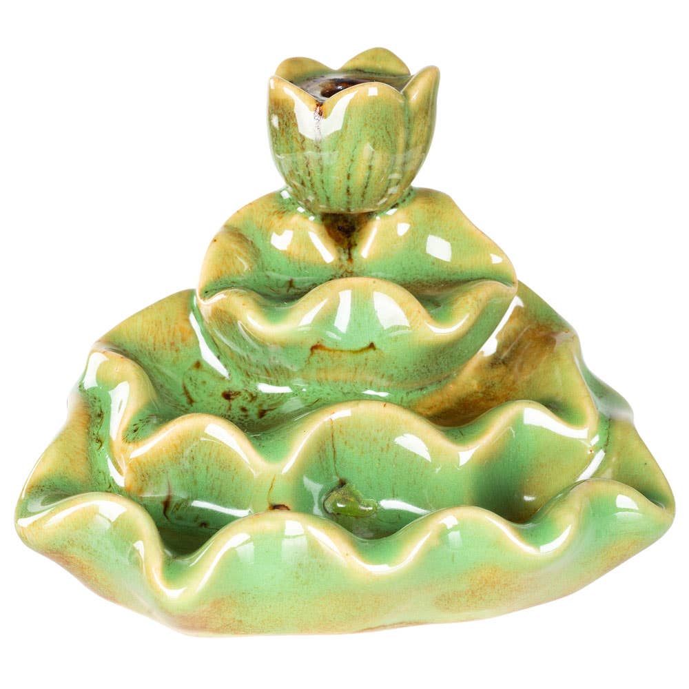 Green ceramic incense burner with lotus design on a white background