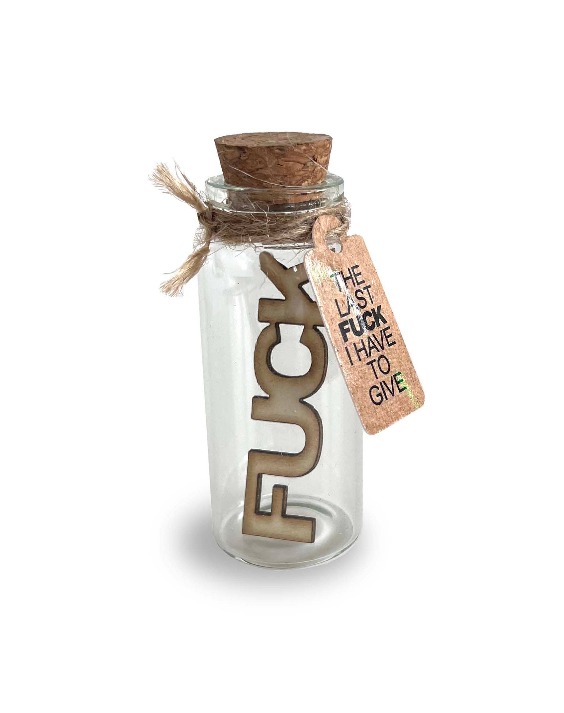 Glass bottle with cork lid and wooden tag with text on a white background
