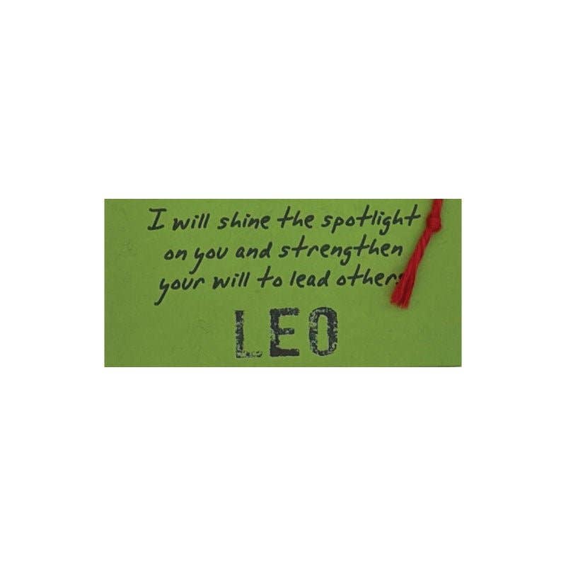 Green card with text and a red string on a white background