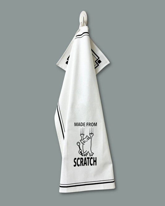 White towel with black text and graphics on a gray background