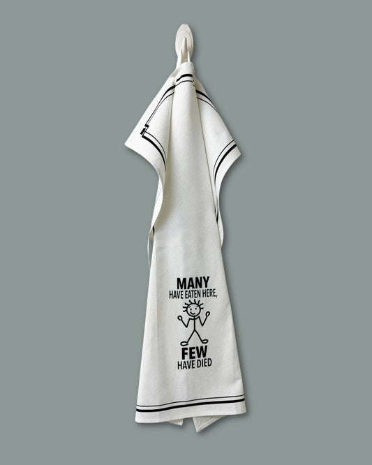 White towel with black text and design on a gray background