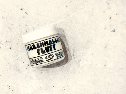 Jar of Marshmallow Fluff sugar lip scrub on a textured white background