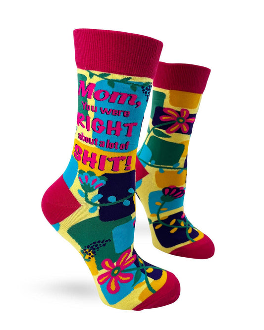Colorful socks with text and patterns on a white background