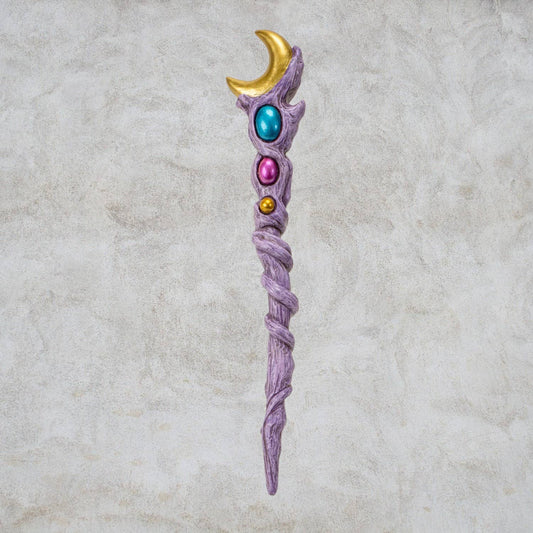 Fantasy staff with colorful gemstones on a textured beige background