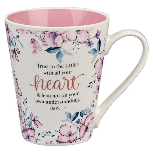 Mug with floral design and motivational quote on a white background