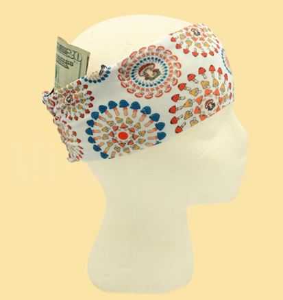 Colorful headband with a pattern on a mannequin head against a beige background