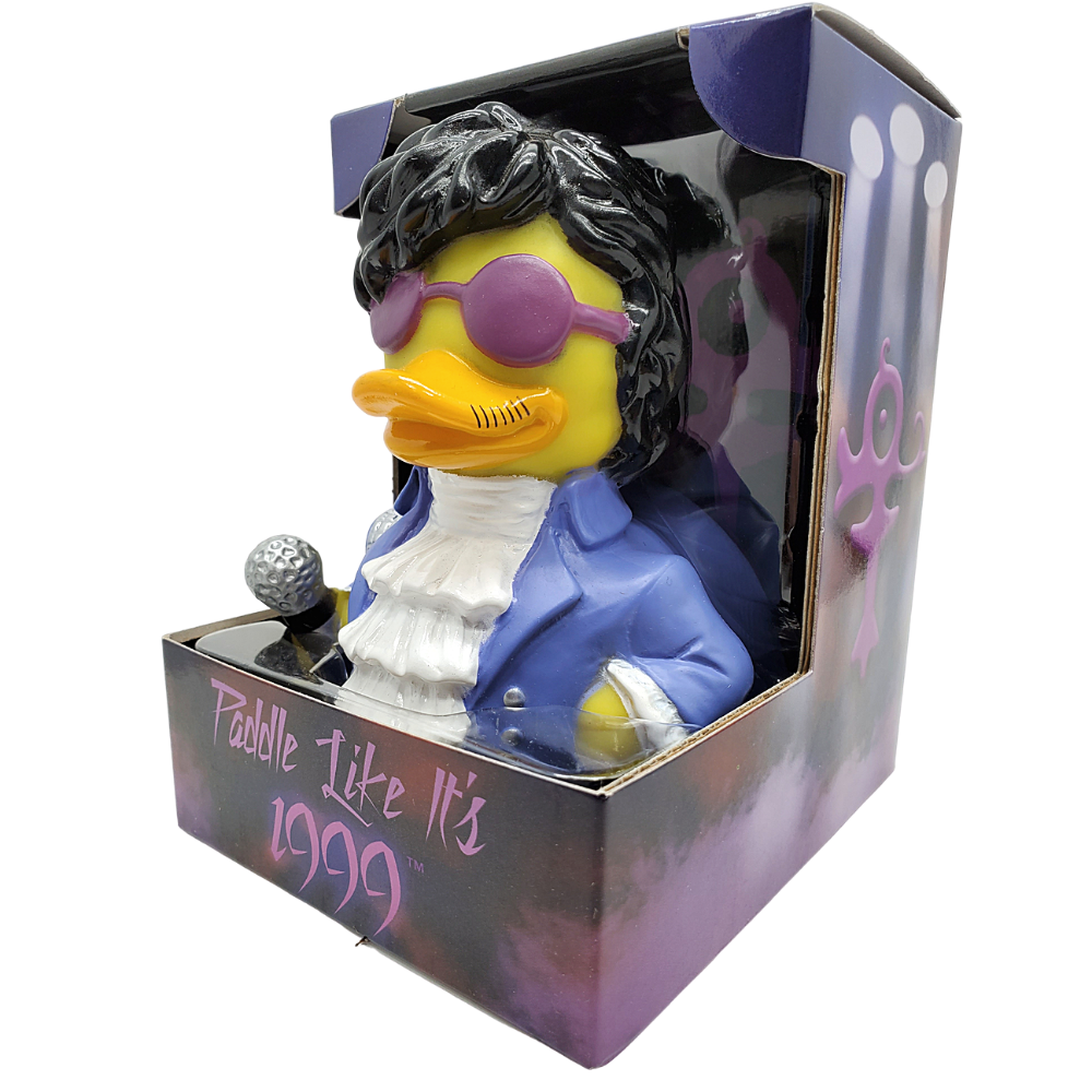 Rubber duck with rock star attire in packaging with 'Paddle Like It's 1999' text.