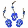 Blue floral earrings with a matching necklace on a white background
