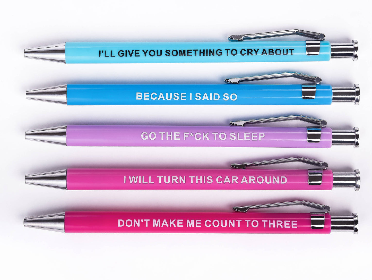 Set of pens with various printed messages on a white background