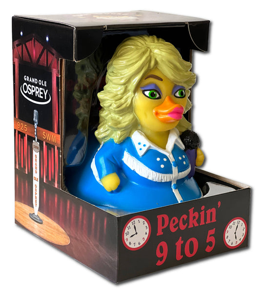 Toy figure of a blonde woman with a blue outfit in a Grand Ole Opry box.