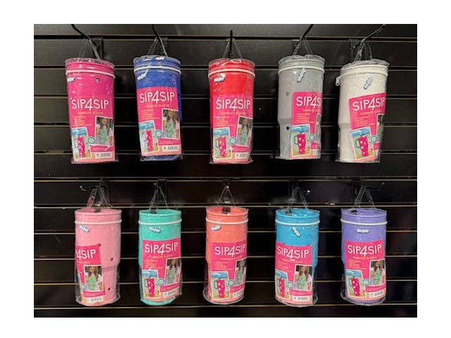 Row of SIP4SIP cups on a black shelving unit