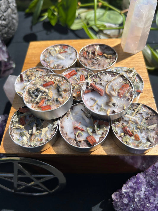 Small containers with various contents on a wooden surface, surrounded by crystals.