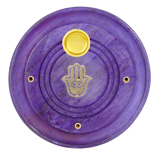 Purple circular object with gold Hamsa hand and eye symbol on a white background