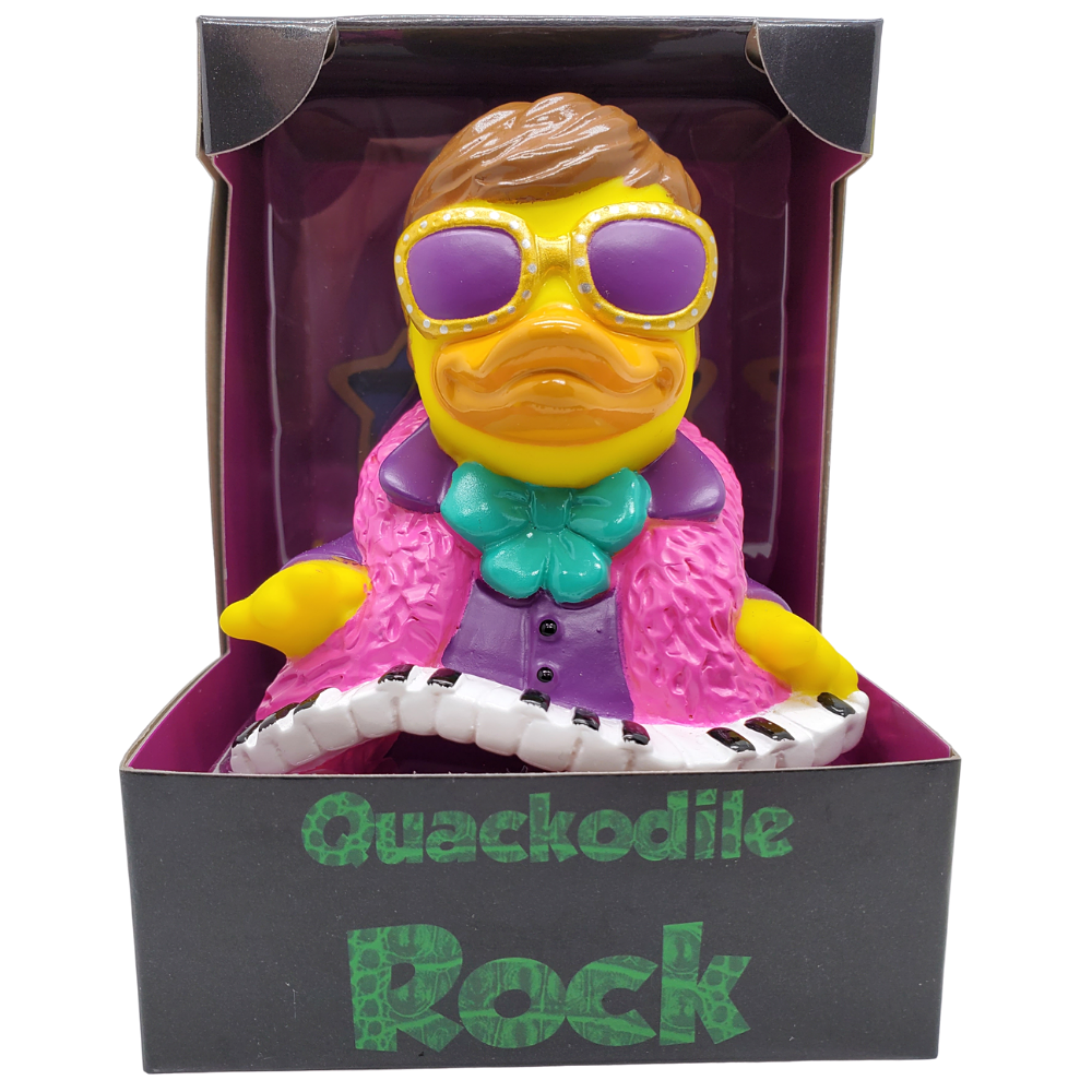 Toy duck with rock attire in a box labeled 'Quackodile Rock'