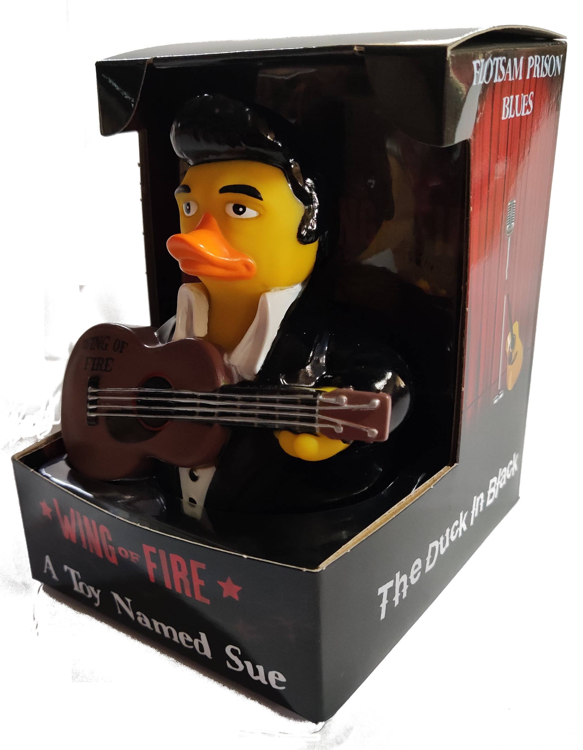 Rubber duck dressed as a musician with a guitar in packaging