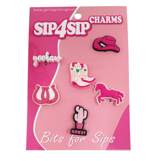 Packaged charms with cowboy boot, lip, horse, and cactus designs on a pink background.