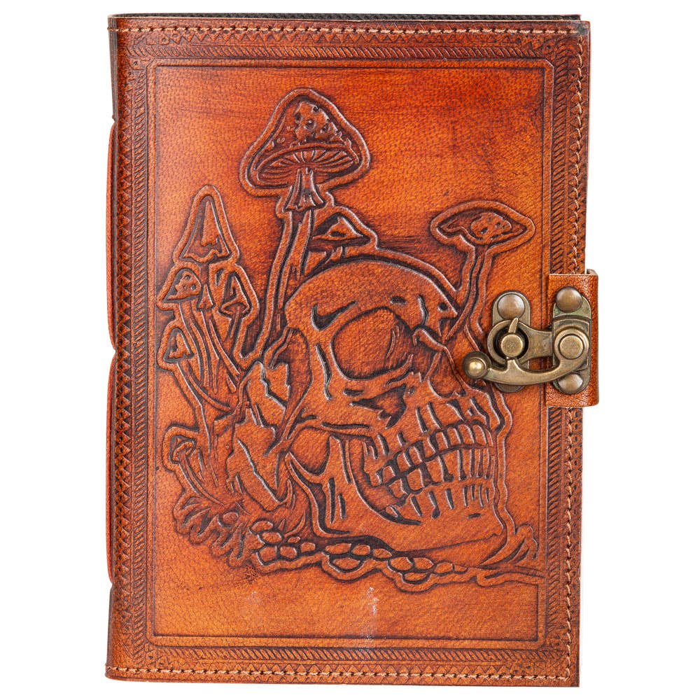 Brown leather journal with skull and mushroom design on a white background