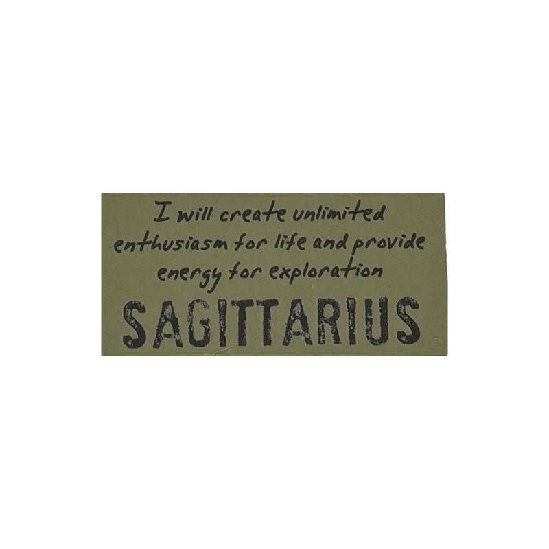 Olive green patch with black text about Sagittarius on a white background