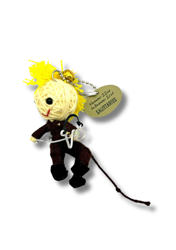 Keychain figure with a yellow head and black body on a white background