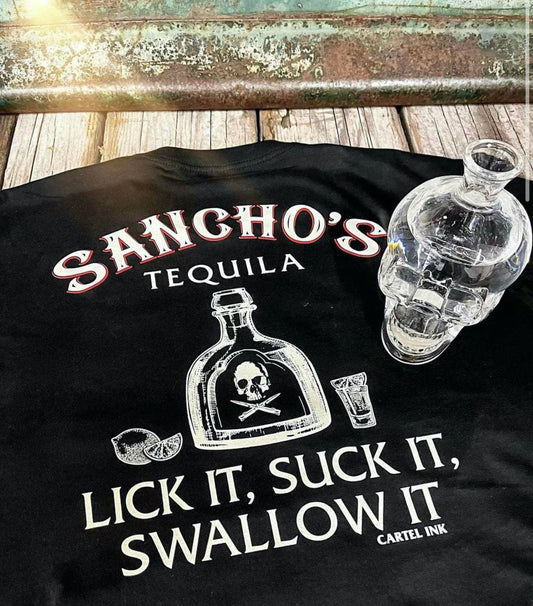 Black t-shirt with 'Sancho's Tequila' design and skull bottle graphic on a wooden surface.