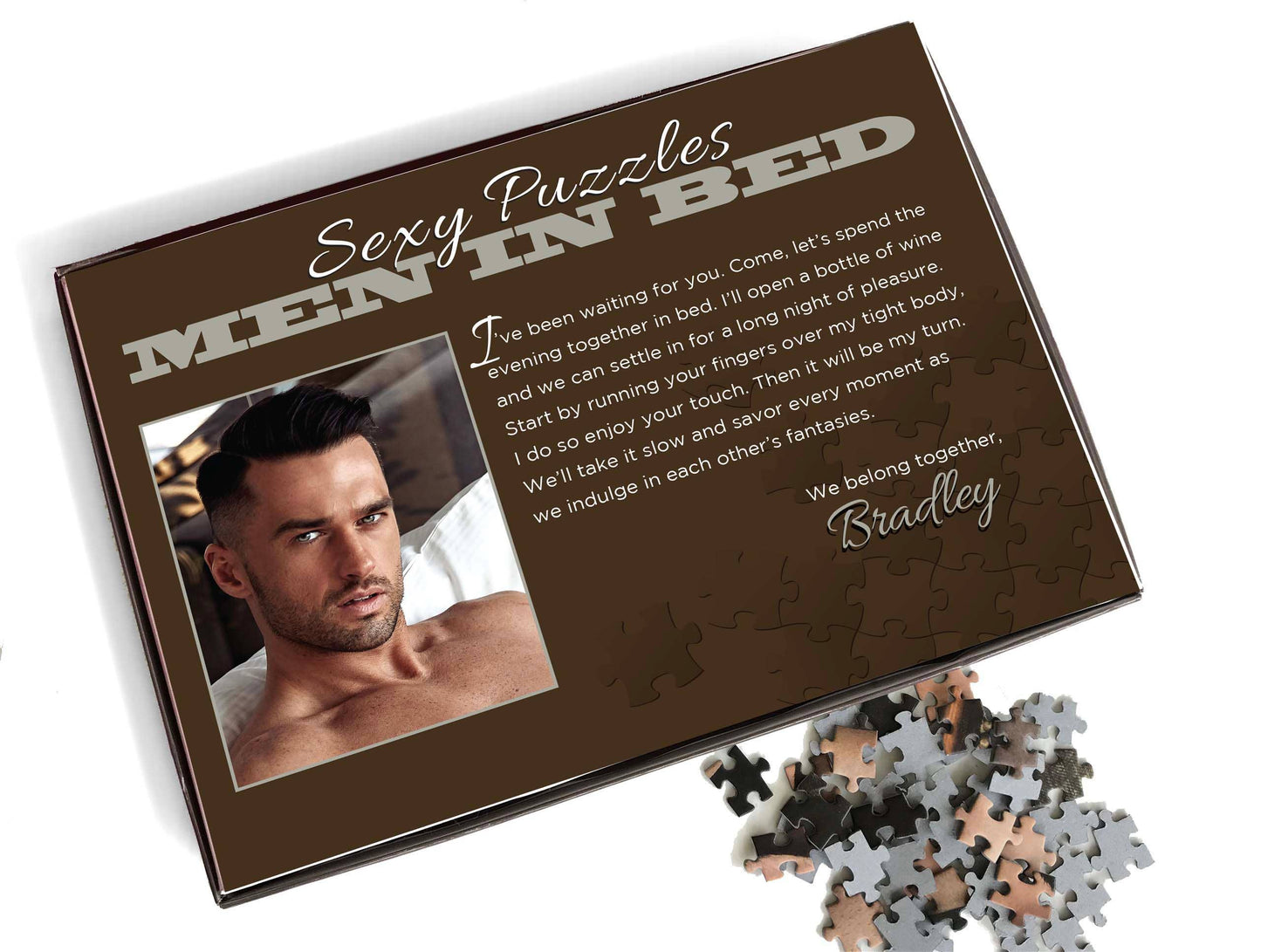 Jigsaw puzzle box titled 'Sexy Puzzles Men in Bed' with a man's face on the cover.