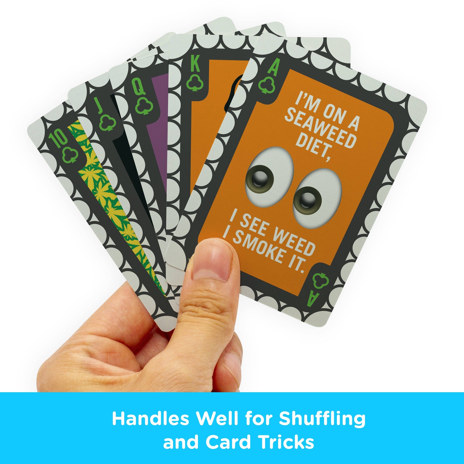Hand holding a set of cards with humorous designs and text.