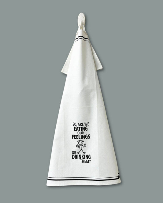 White towel with black text and graphic on a gray background