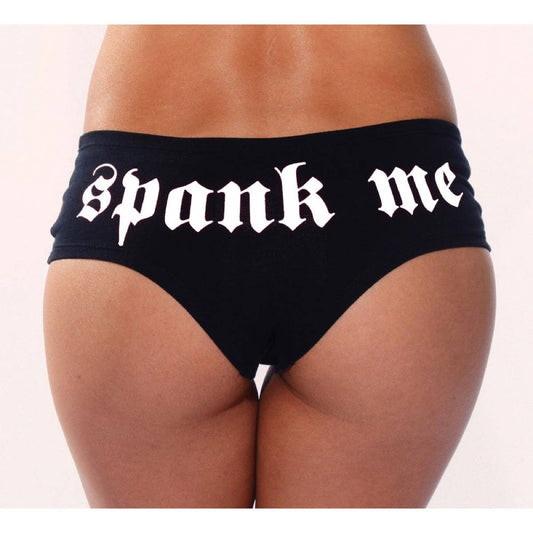 Black underwear with 'Spank me' text on a white background