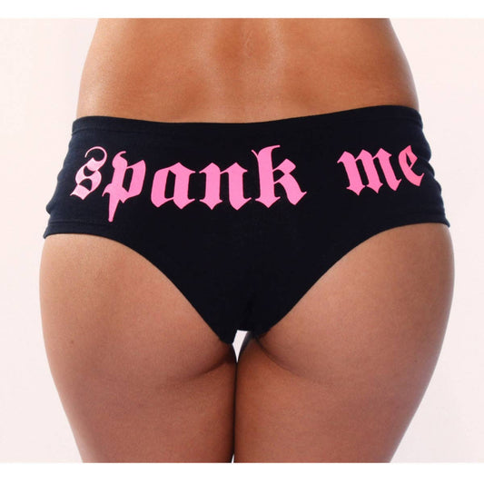 Black underwear with pink 'spank me' text on a white background