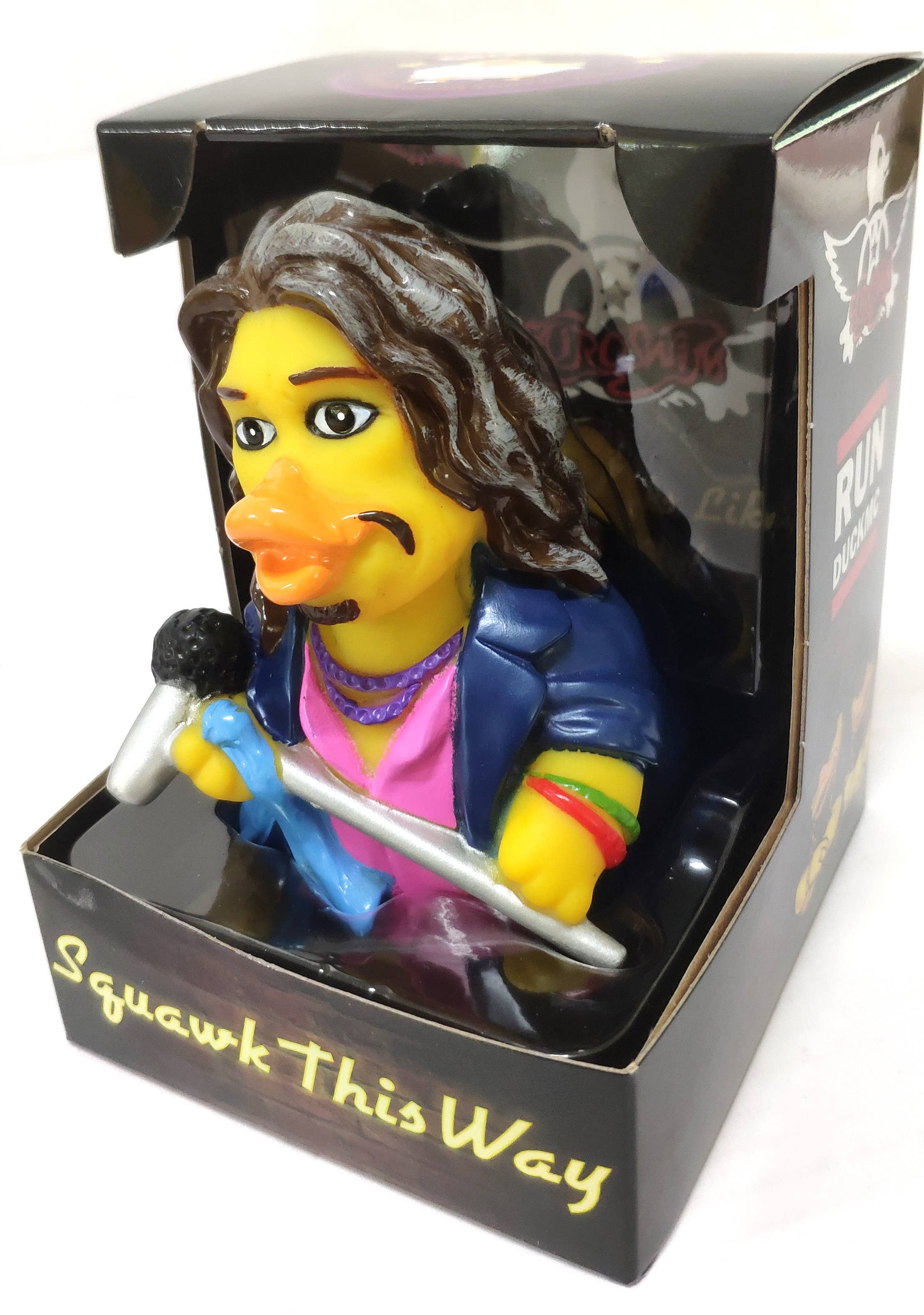 Rubber duck with a microphone in packaging labeled 'Squawk This Way'