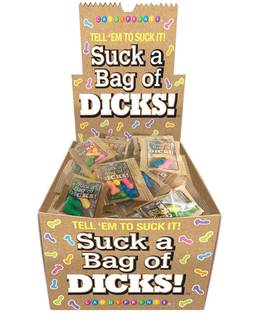 Display box of 'Suck a Bag of Dicks' candy packs with colorful text and packaging.
