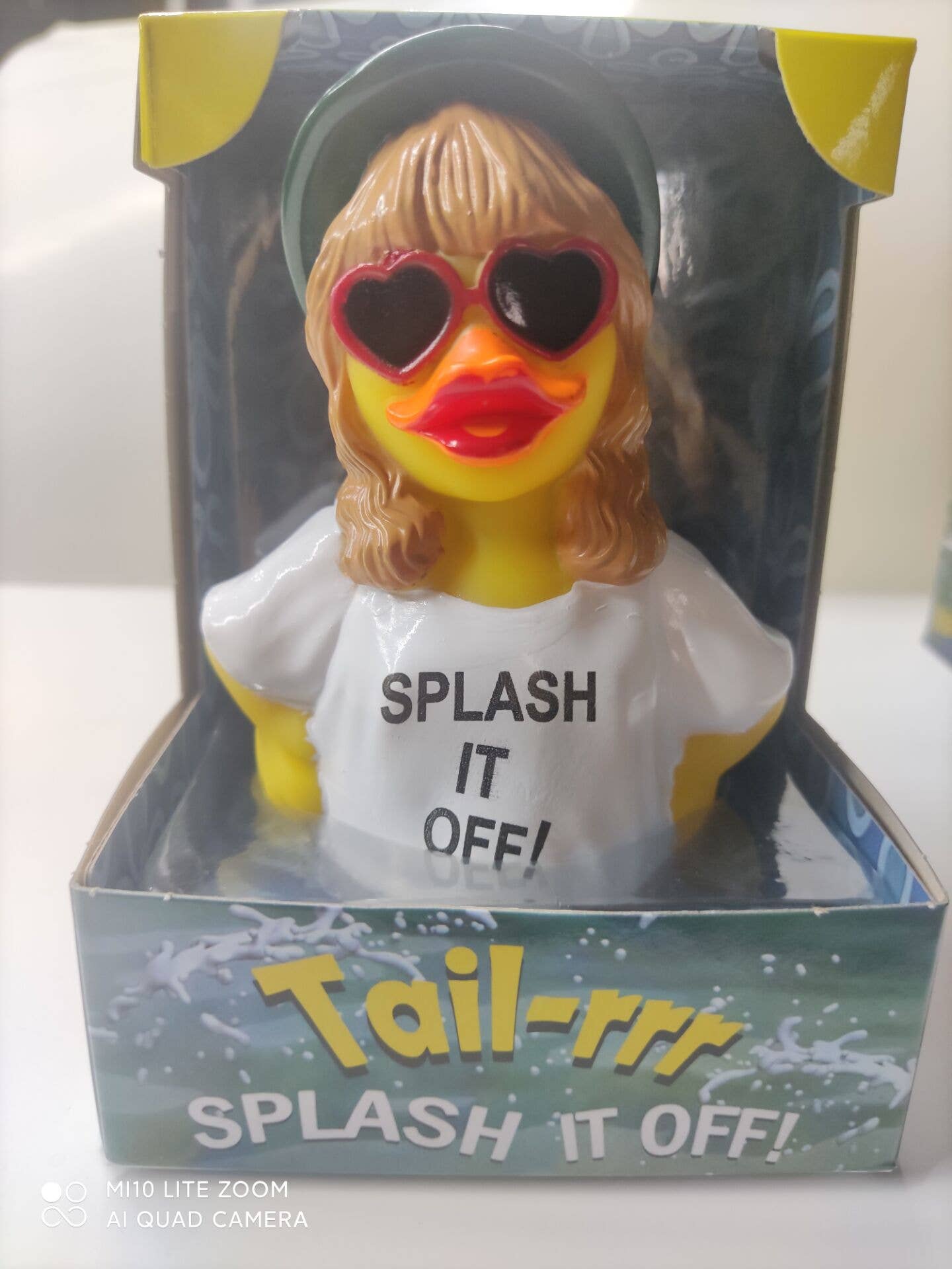 Rubber duck with sunglasses and 'SPLASH IT OFF!' shirt in packaging
