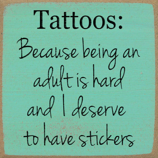 Text on a teal background with a humorous quote about tattoos.