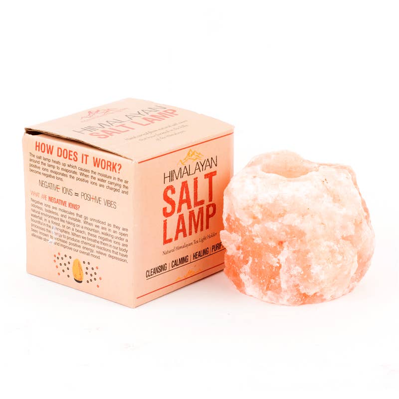 Himalayan salt lamp with packaging on a white background