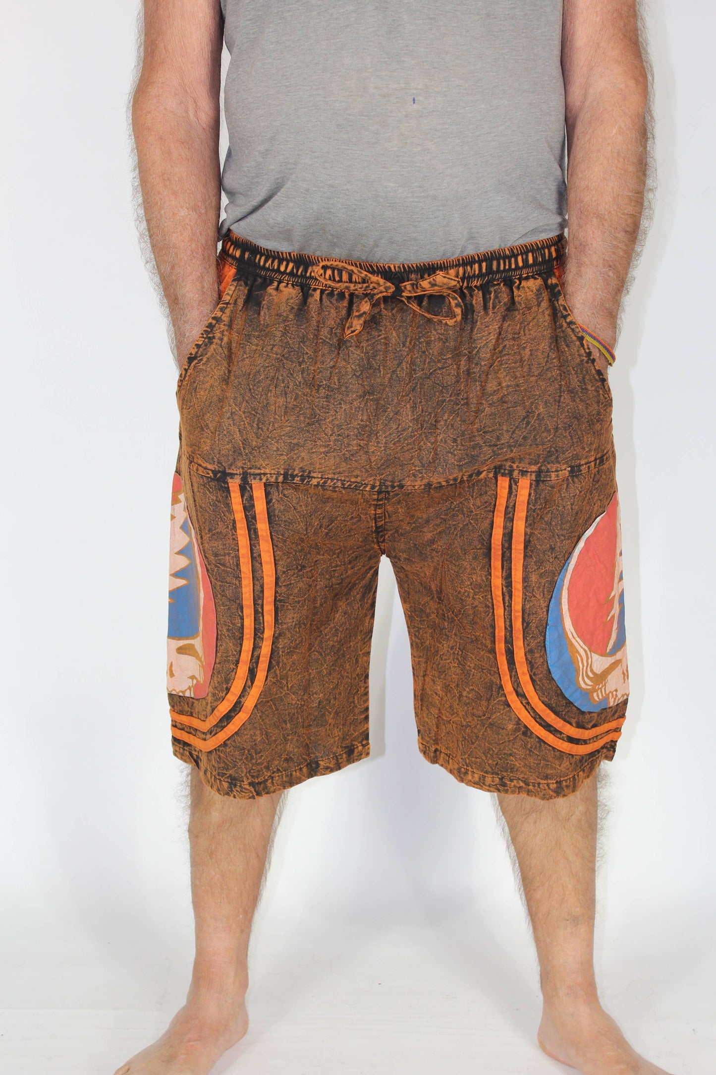 Brown shorts with colorful patterns on a white background