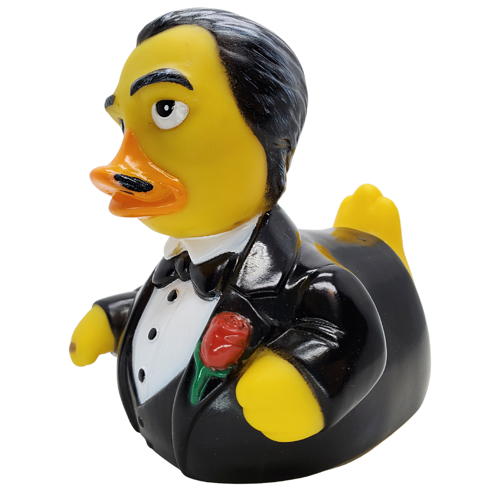 Rubber duck dressed in a tuxedo with a red rose on a white background