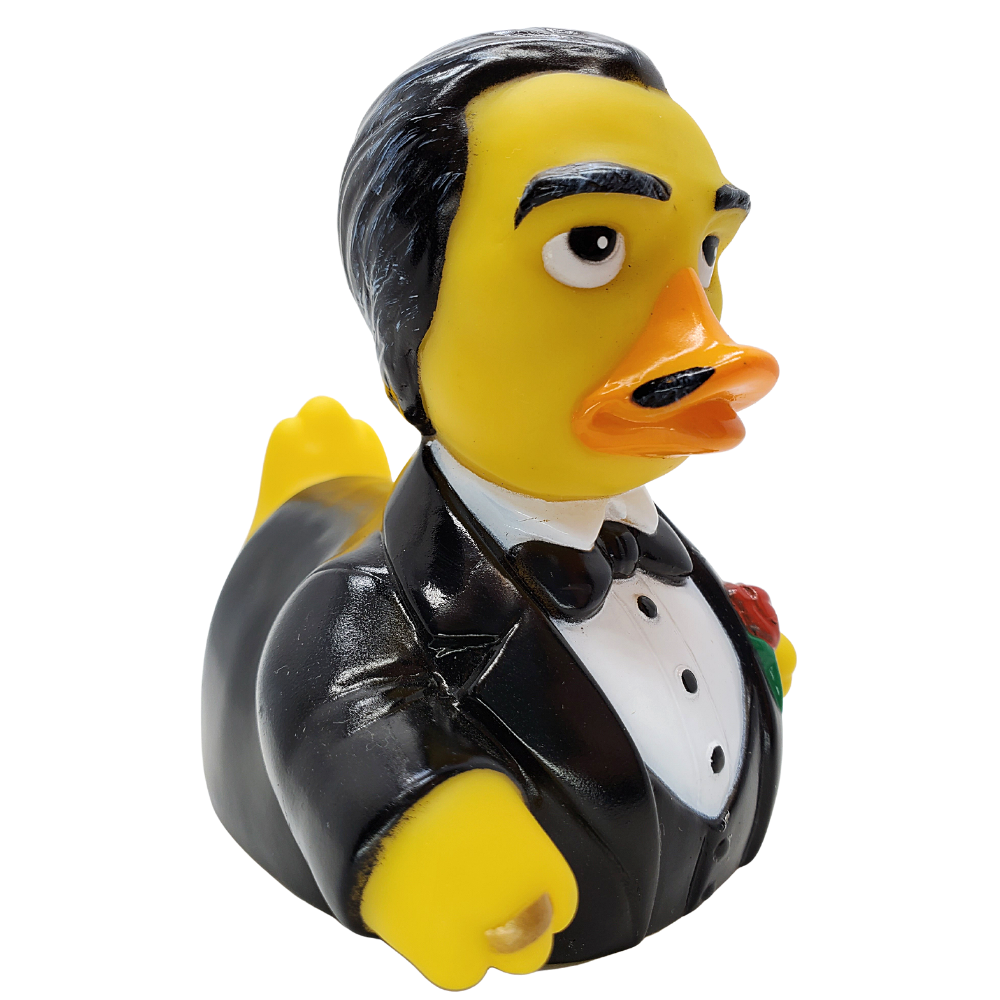 Rubber duck dressed in a tuxedo with a white shirt and black bow tie on a white background