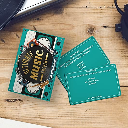 Music trivia card game on a wooden surface