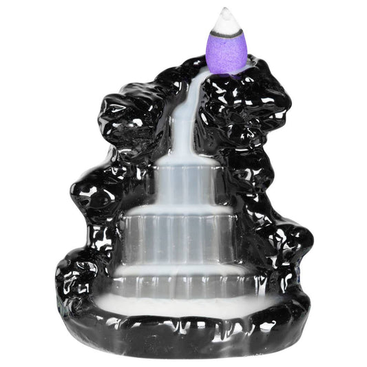 Black incense burner with a purple incense stick on a white background