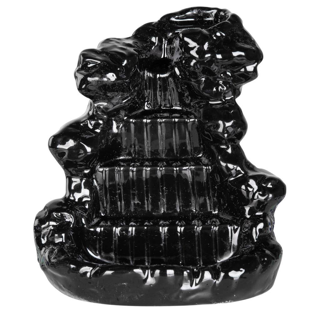 Black ceramic pagoda-shaped object on a white background