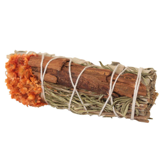 Bundled sage with orange flowers tied together on a white background