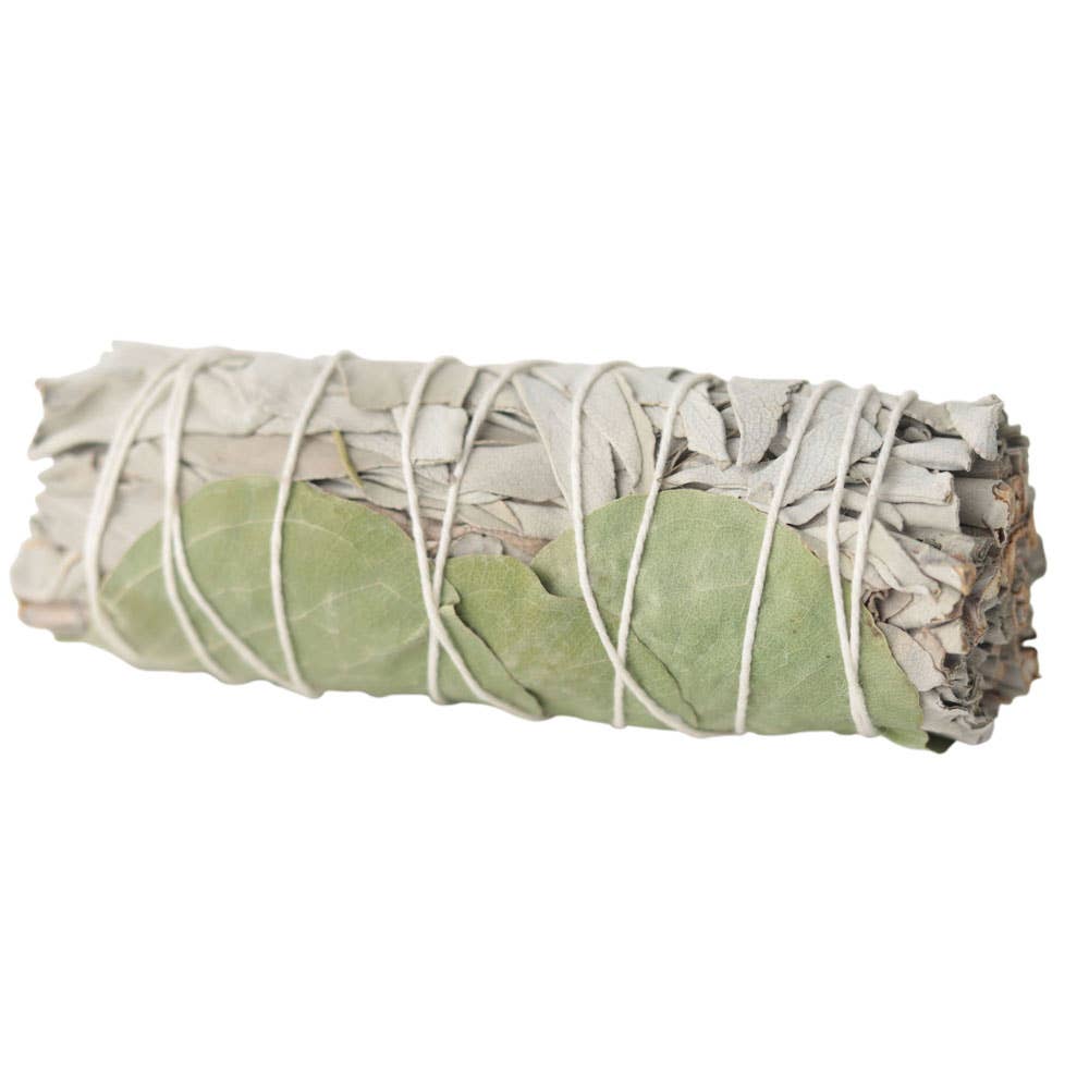 Bundled sage with white twine on a white background
