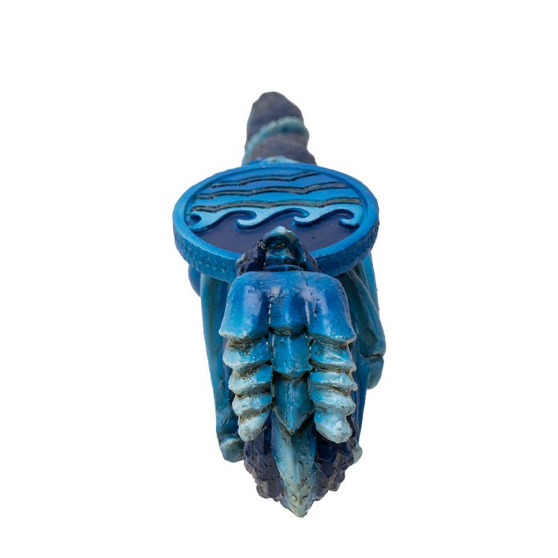 Blue decorative item with wave design on a white background